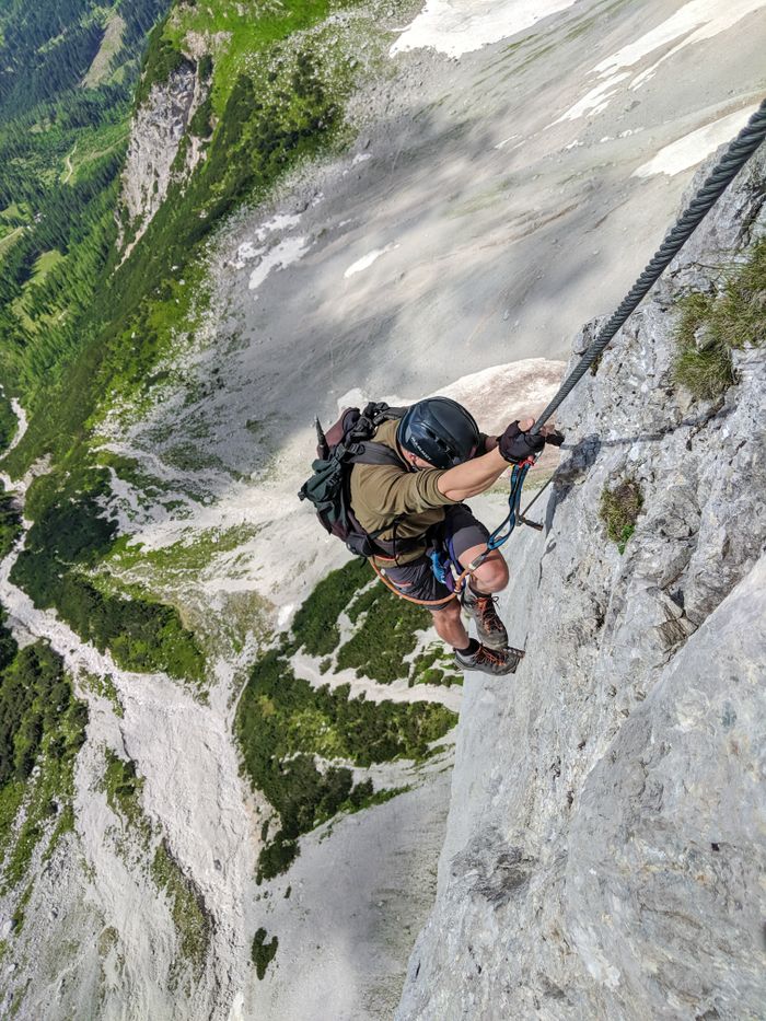 services-img Experience the thrill of rock climbing as this climber tackles a steep cliff with determination.